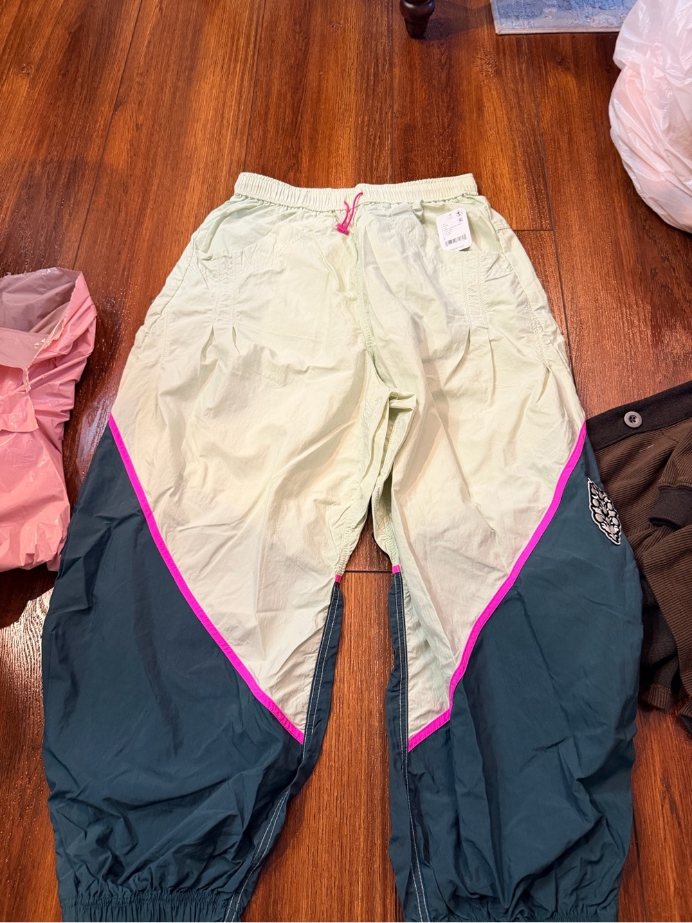 Womens Two-Tone Windbreaker Joggers in Light Green and Dark Teal with Pink Trim